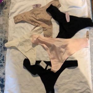 4 body by Victoria and one express thongs.